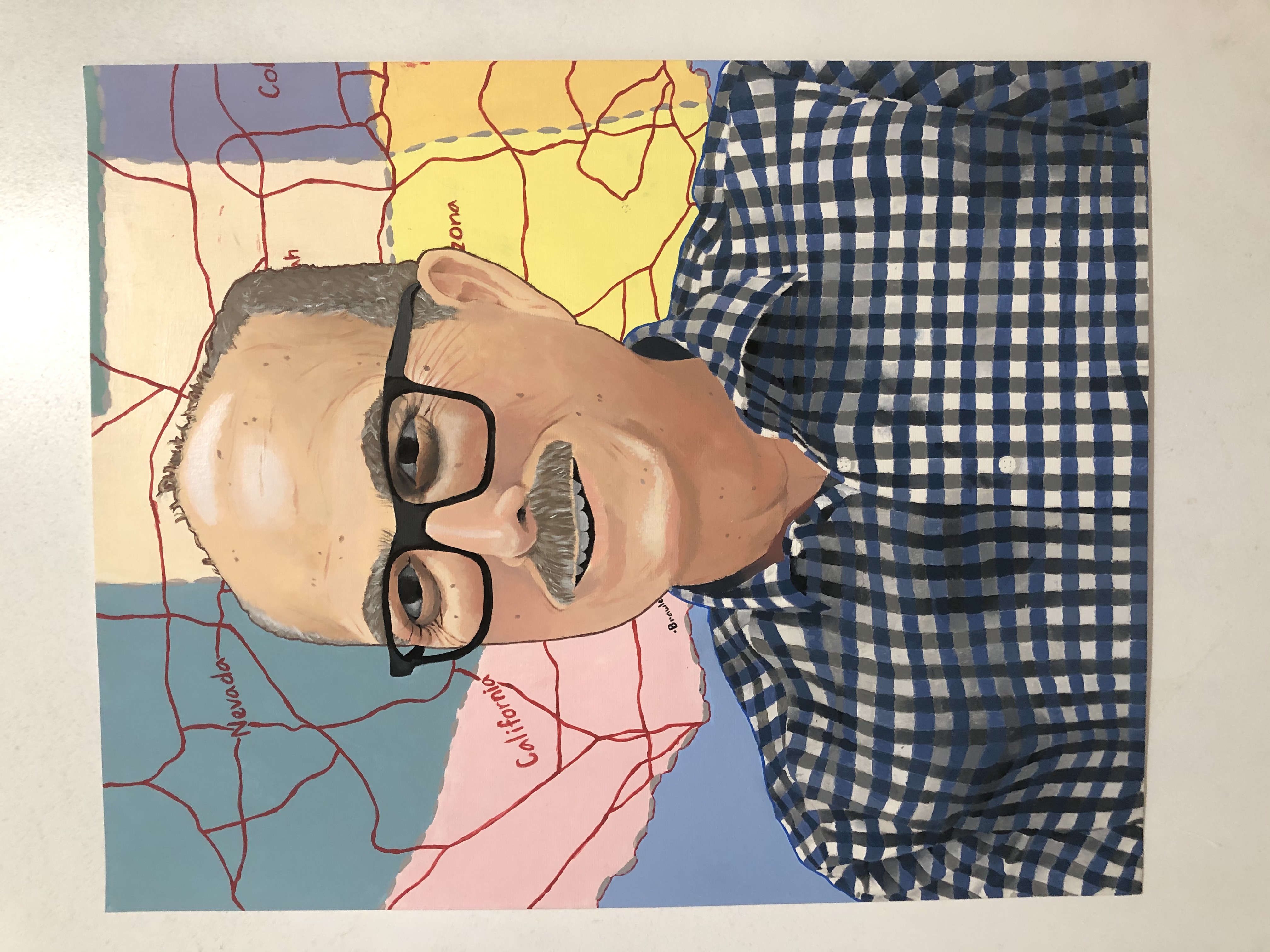 A painting of a U.S. History teacher, wearing glasses and a blue plaid shirt. In the background is part of a colorful map of the United States.